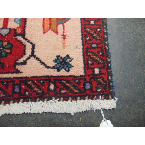 25 - Persian red ground rug, having geometric pattern, 78 x 34