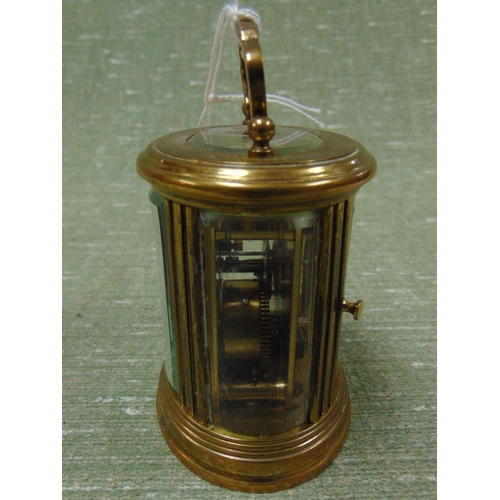 44 - Miniature French brass cased carriage clock, having enamel face and Roman numerals. 4