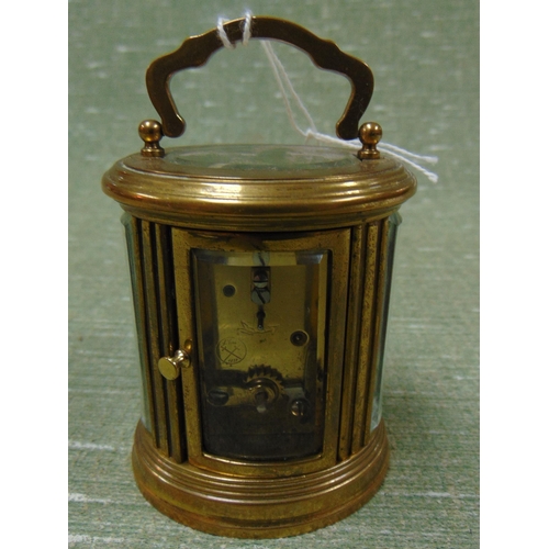 44 - Miniature French brass cased carriage clock, having enamel face and Roman numerals. 4