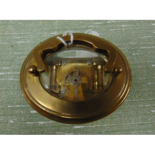 44 - Miniature French brass cased carriage clock, having enamel face and Roman numerals. 4