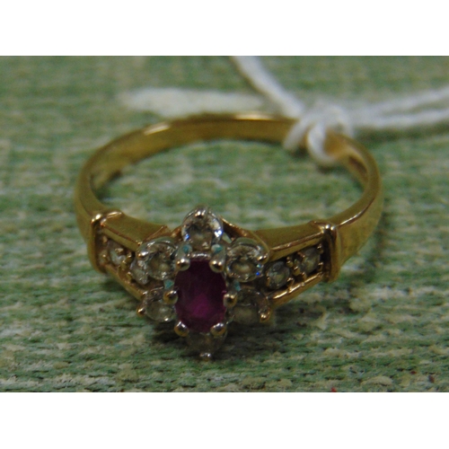 456 - 9ct gold ring, set with oval ruby and diamonds.