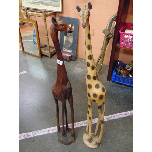 49 - Two wooden giraffe figures.