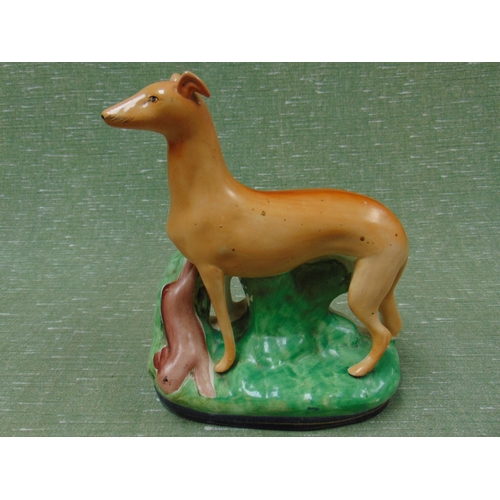 53 - Antique Staffordshire figure group, Greyhound and Hare, 10.5