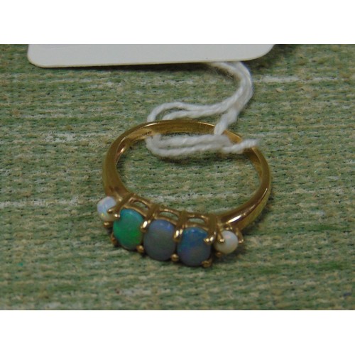 61 - 9 K Black and multicoloured opal yellow gold ring.