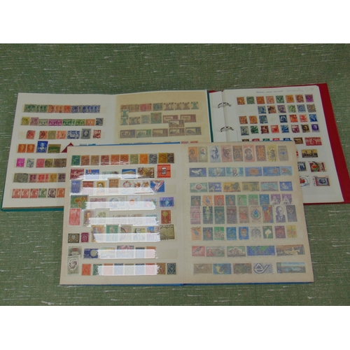 391 - Three albums of stamps.