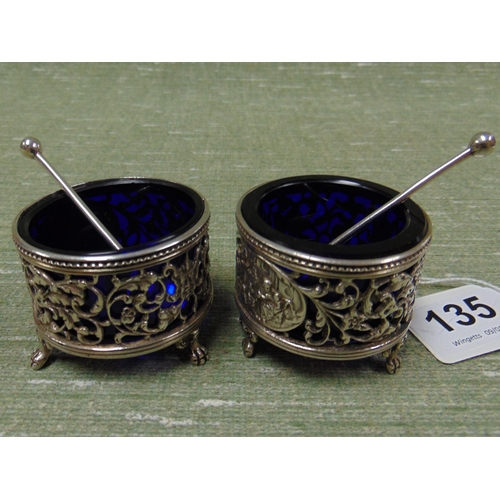 135 - Pair of antique Dutch silver salts and spoons, with blue glass liners.