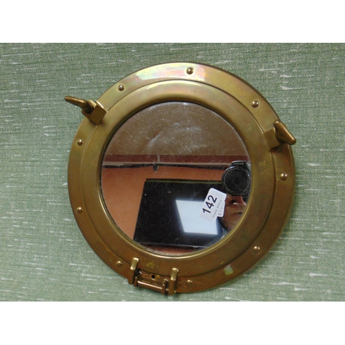 142 - Reproduction porthole style wall mirror, 11