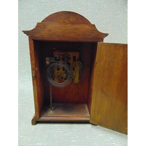 176 - Edwardian oak cased mantle clock, shaped top, Arabic numerals with shell inlay decoration and on bra... 