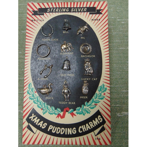 194 - Selection of silver Christmas pudding charms.