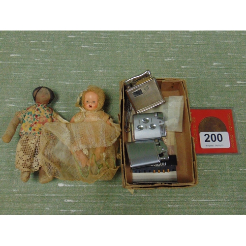 200 - Two miniature dolls and some lighters.