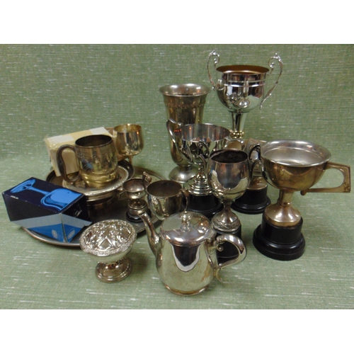 249 - Small silver two handled trophy and a collection of plated trophies, etc.