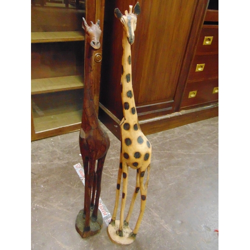 298 - Two wooden giraffe figures.