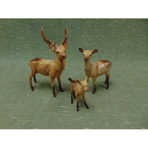 384 - Beswick stag, doe and fawn. (3)