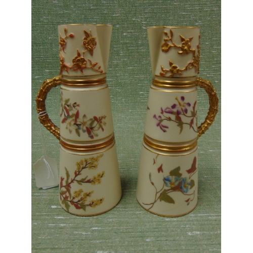 387 - Pair of Worcester 1047 gilt and floral ewers, each 8