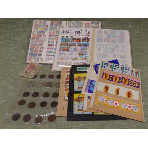 390 - Two stamp albums and some coins.