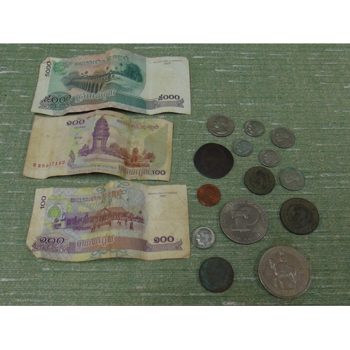 393 - Small collection of coins and paper money.