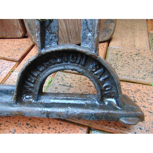 415 - Antique pitch pine railway  bench, having cast iron ends embossed 'patent automatic' and 'Wellington... 