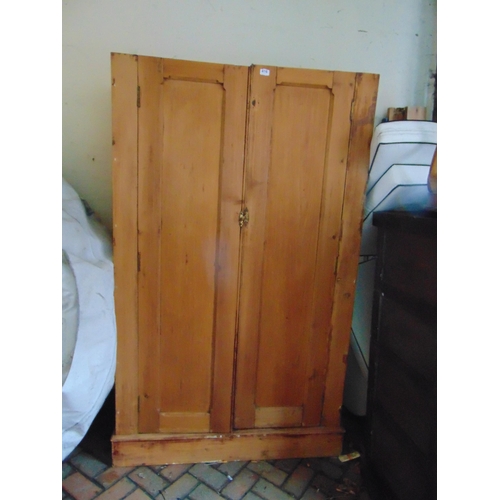 416 - Pitch pine double door wardrobe.