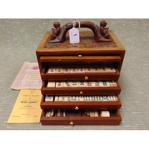 1 - Chinese bone Mahjong set, contained in a hardwood cabinet, having pull up front and five drawers. 9.... 