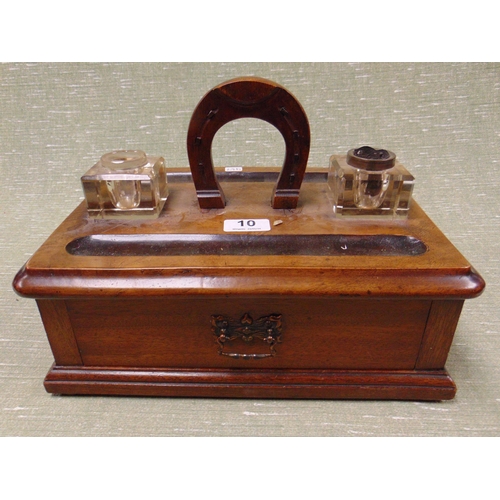 10 - Victorian mahogany desk stand, horseshoe form handle, pair of glass ink wells and single drawer to b... 