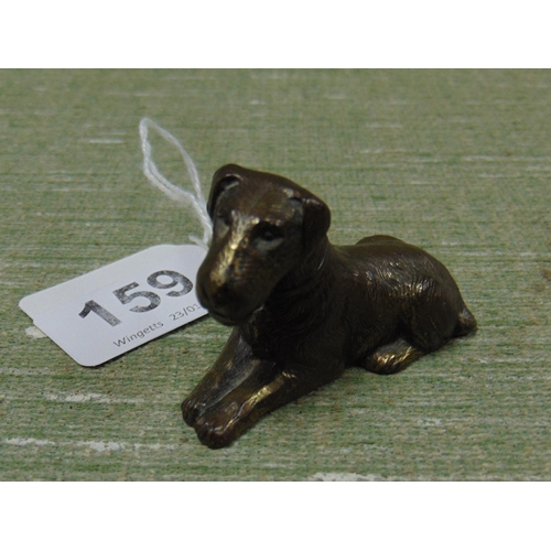 159 - Brass figure of a seated dog. 2.5