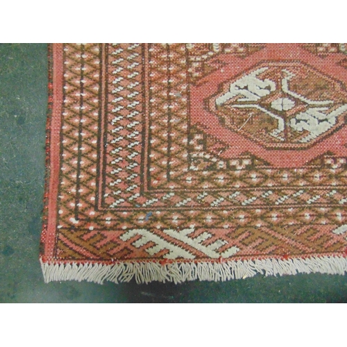 185 - Persian red ground rug , having geometric pattern. 55 x 39