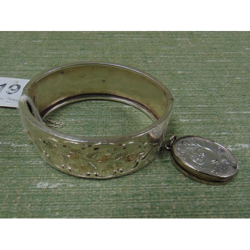 191 - Silver bangle and a possibly silver locket.