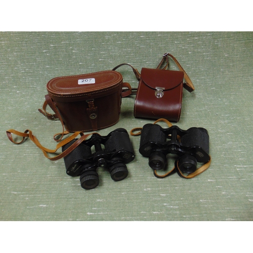 207 - Two cased pairs of binoculars.