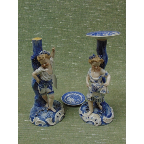 209 - Pair of antique blue and white china figures, modelled as a boy and girl, with anchor mark to base. ... 