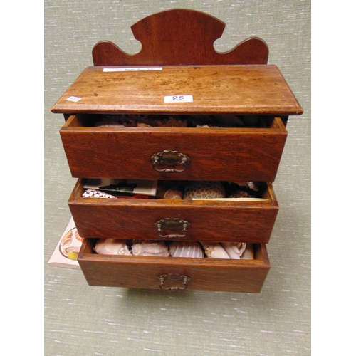 25 - Edwardian oak table top chest, raised back over four drawers with metal handles, containing a collec... 