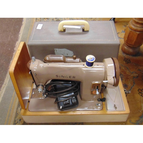 276 - Cased Singer sewing machine.