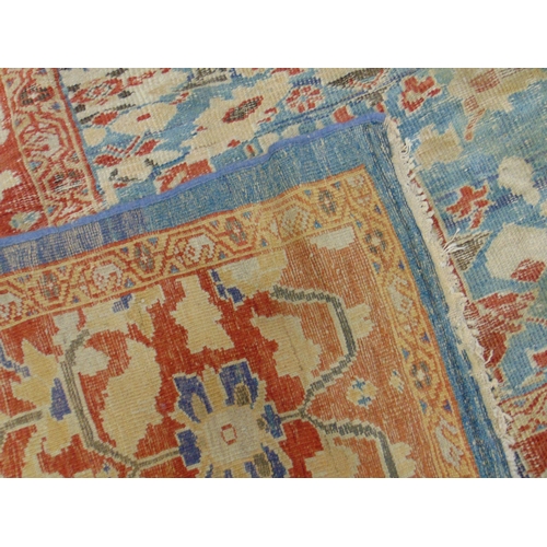 367 - Large red and blue ground rug, having geometric floral pattern, 179 x 129