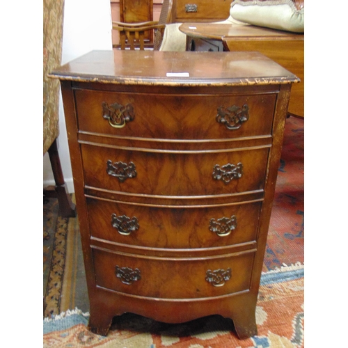 382 - Walnut veneered bow fronted sewing chest, lift up top revealing a fitted interior, above two faux an... 