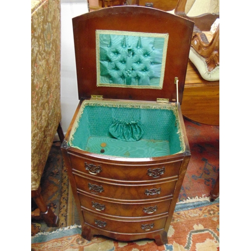 382 - Walnut veneered bow fronted sewing chest, lift up top revealing a fitted interior, above two faux an... 