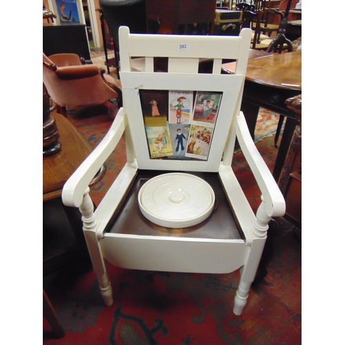 392 - Painted commode arm chair, the  interior decorated with vintage postcards.