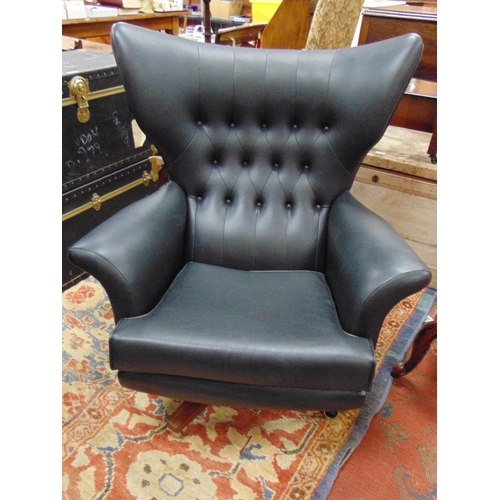 394 - G Plan retro wing back swivel chair.