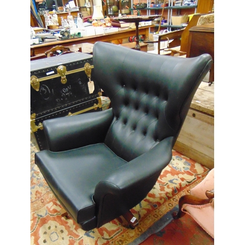 394 - G Plan retro wing back swivel chair.