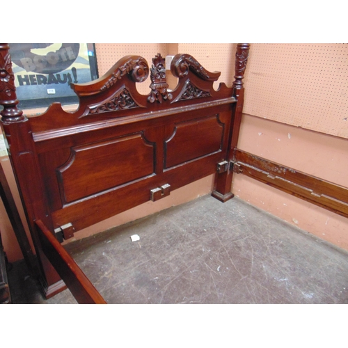 416 - Reproduction hardwood four poster bed, having carved decoration. 85 x 90 x 66