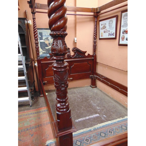 416 - Reproduction hardwood four poster bed, having carved decoration. 85 x 90 x 66