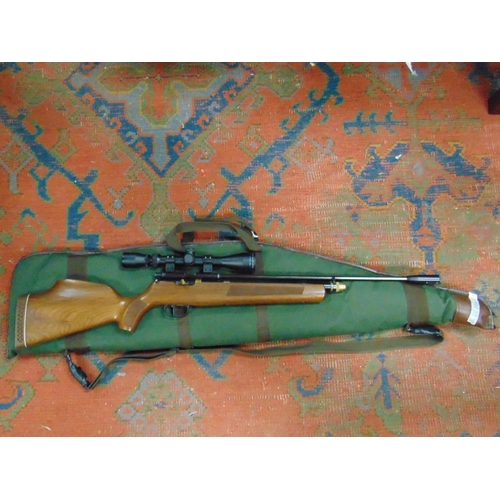 46 - Gas powered .22 air rifle with scope in slip. Please note: Purchasers must be over 18 and photograph... 