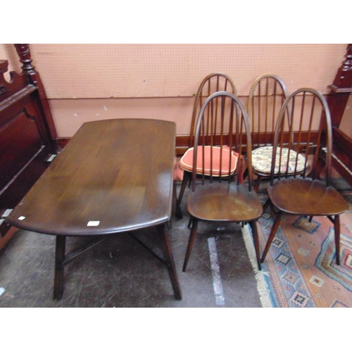 473 - An Ercol dining suite, comprising drop leaf table and four stick back chairs.