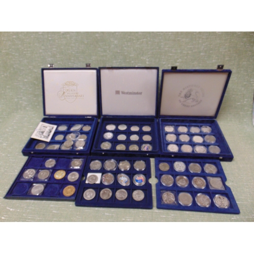 70 - Three cases of collectable coins.