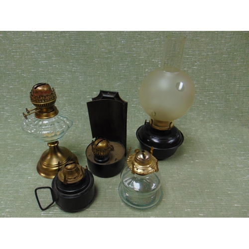 106 - Various oil lamps.