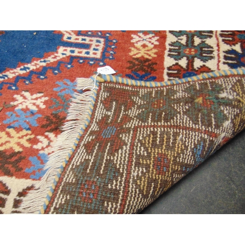 108 - Red and blue ground rug, having geometric pattern. 76 X 59