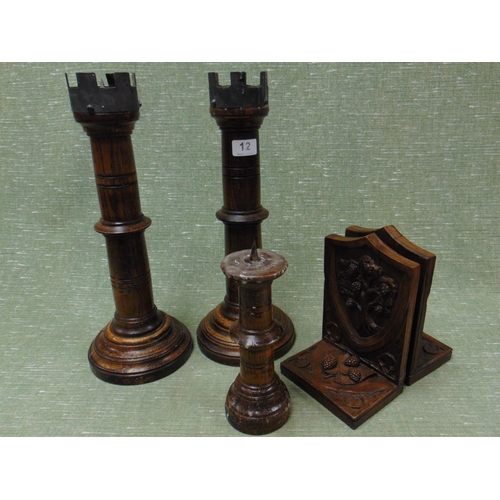 12 - Pair of Mulberry oak castellated form candlesticks, each 16.5