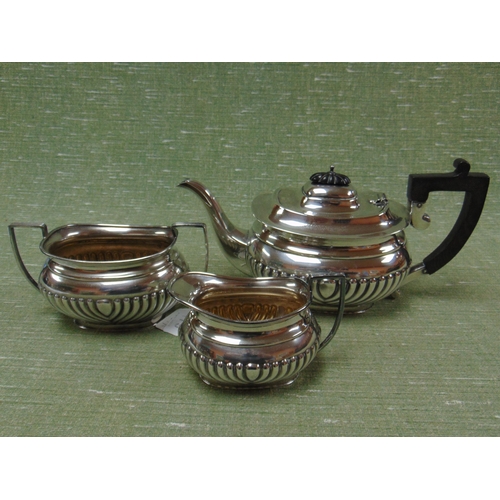 179 - EPNS three piece tea service, having gadrooned decoration.