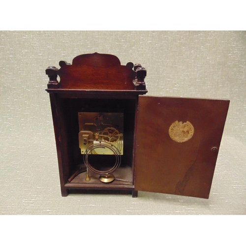 222 - Beaver Cross Street Manchester mahogany cased mantle clock, having brass face and Roman numerals. 14... 