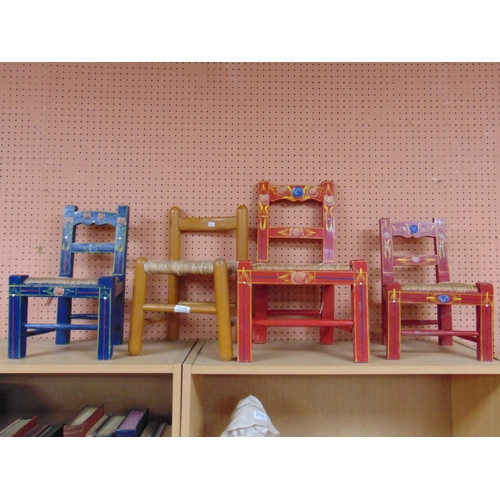 309 - Three painted child's chairs and one other example. (4)