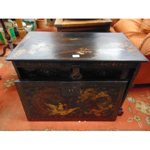 326 - An Oriental lacquered chest, fall front revealing six short drawers with metal handles, having tradi... 