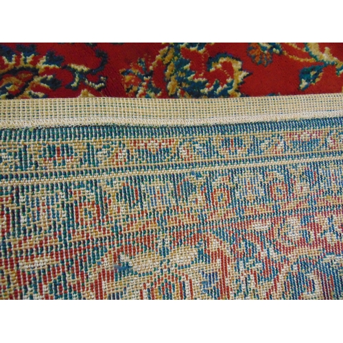 348 - William Morris influenced rug, having blue and red geometric pattern. 112 x 79